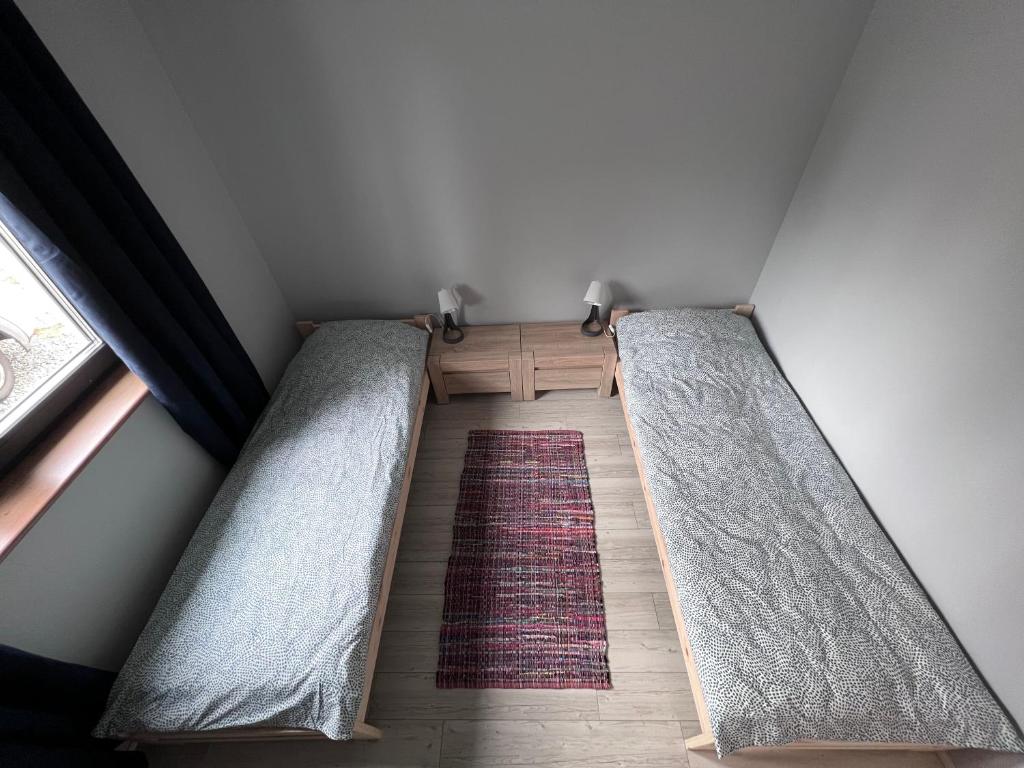 Posteľ alebo postele v izbe v ubytovaní Apartament Pod Jaworami z antresolą