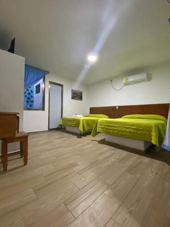 Postel nebo postele na pokoji v ubytování Hotel El Rincon de Don Juan