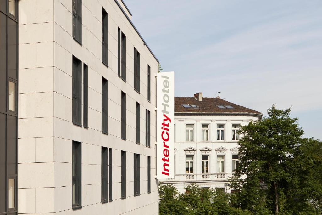 a white building with a sign on the side of it at IntercityHotel Bonn City in Bonn