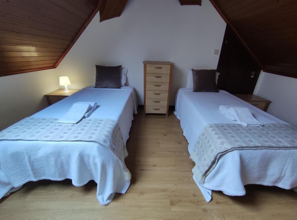 Postel nebo postele na pokoji v ubytování casa cardeal saraiva