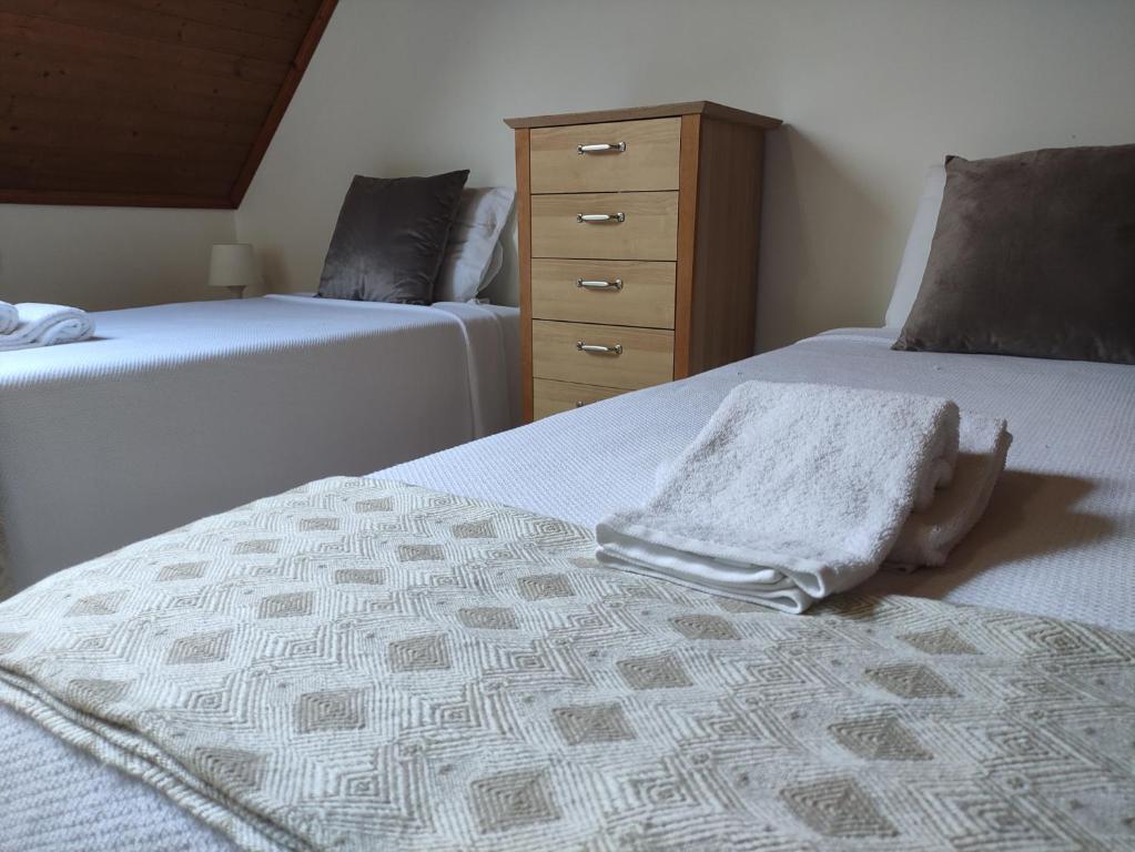 Postel nebo postele na pokoji v ubytování casa cardeal saraiva