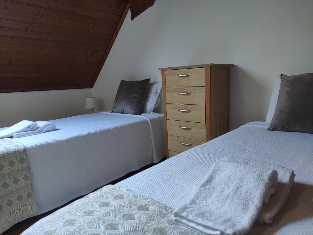 Postel nebo postele na pokoji v ubytování casa cardeal saraiva