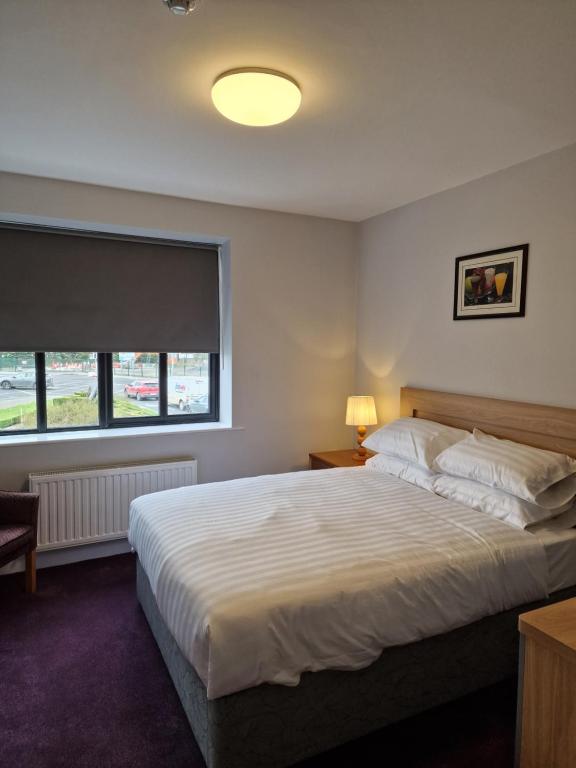 Postel nebo postele na pokoji v ubytování Home Inn