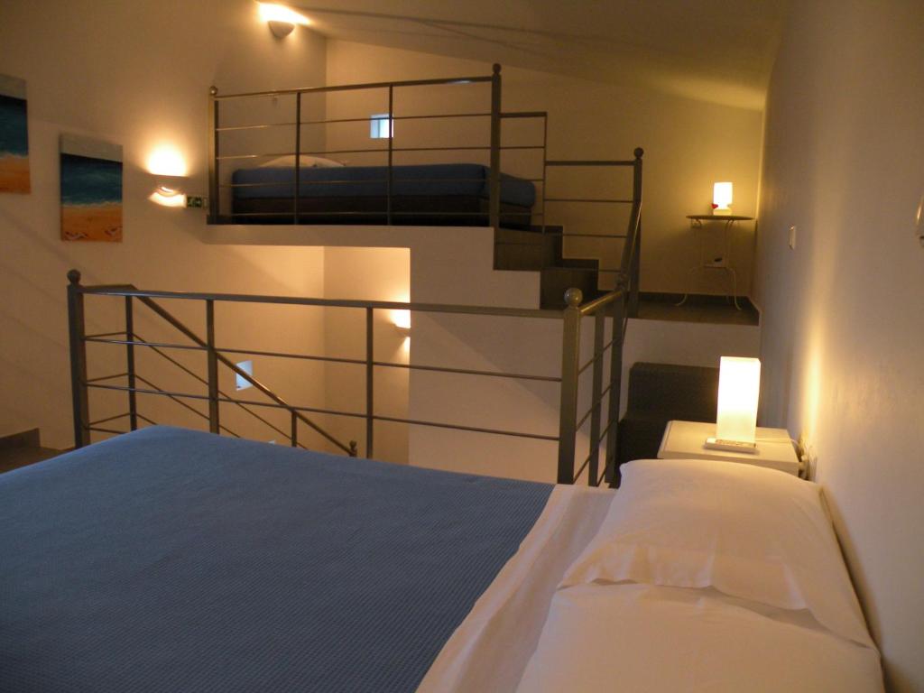 Postel nebo postele na pokoji v ubytování Zathea Apartments