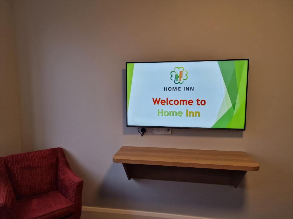 TV a/nebo společenská místnost v ubytování Home Inn