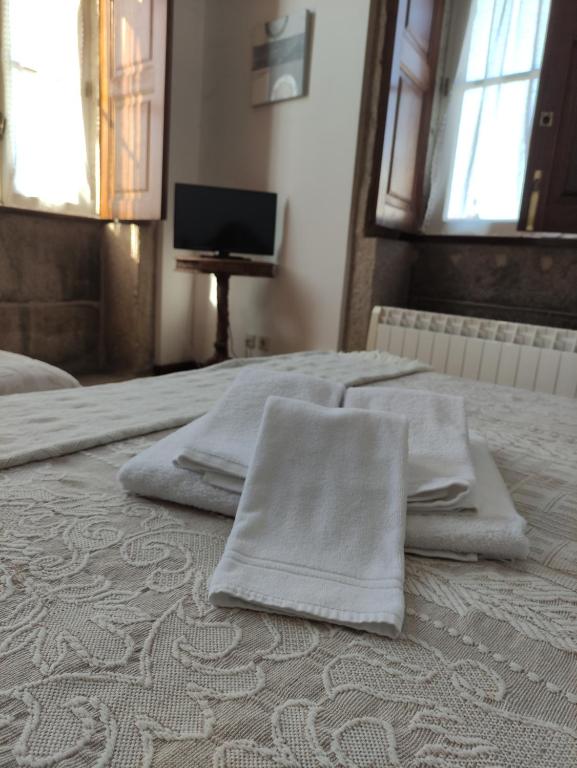 Postel nebo postele na pokoji v ubytování casa cardeal saraiva