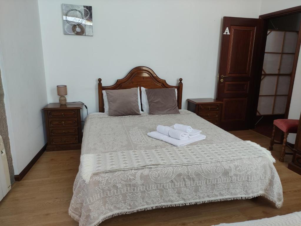 Postel nebo postele na pokoji v ubytování casa cardeal saraiva