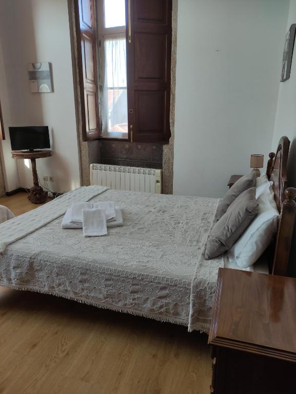 Postel nebo postele na pokoji v ubytování casa cardeal saraiva