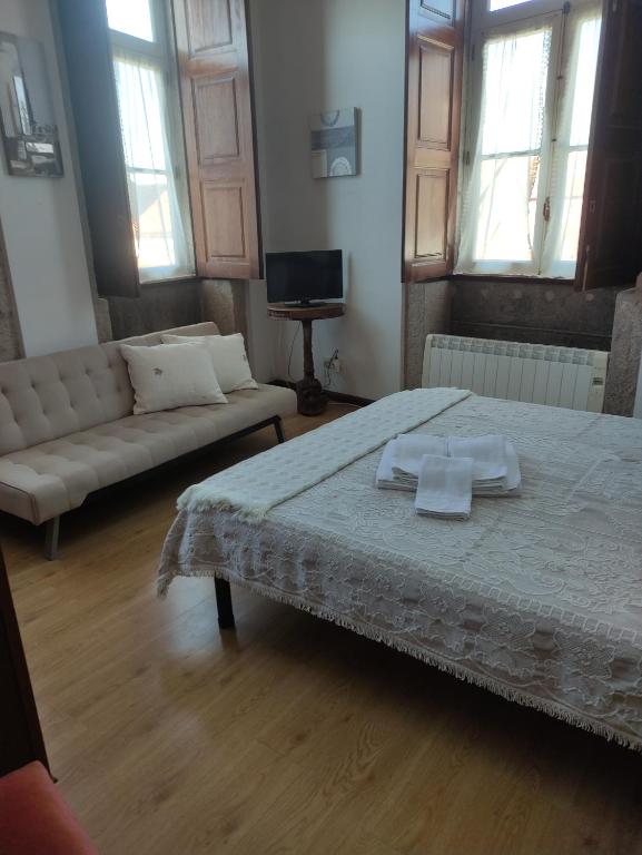 Postel nebo postele na pokoji v ubytování casa cardeal saraiva