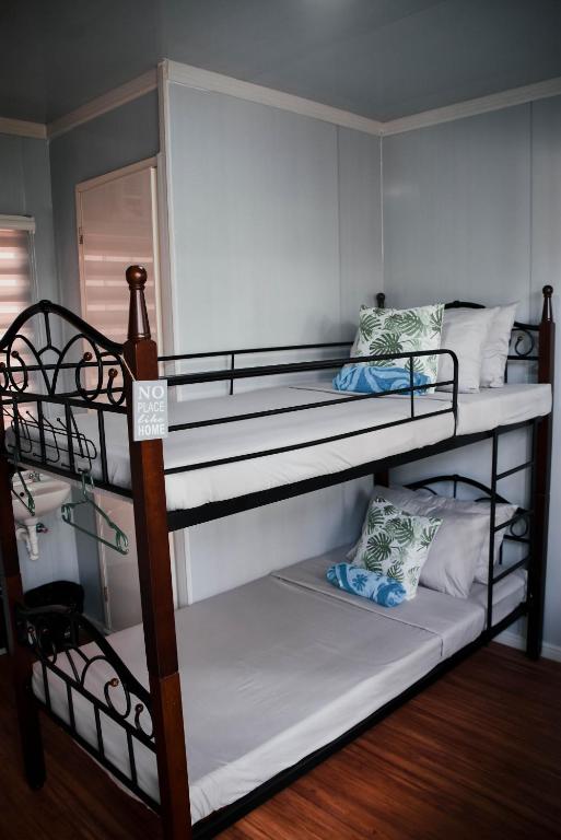 Postel nebo postele na pokoji v ubytování Olive Hostel Roxas City