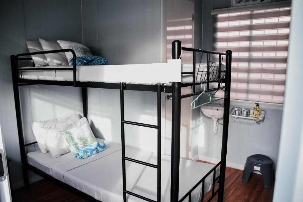 Postel nebo postele na pokoji v ubytování Olive Hostel Roxas City