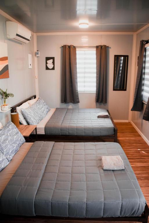 Postel nebo postele na pokoji v ubytování Olive Hostel Roxas City