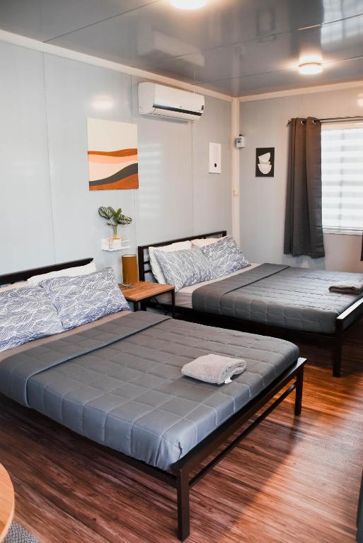 Postel nebo postele na pokoji v ubytování Olive Hostel Roxas City