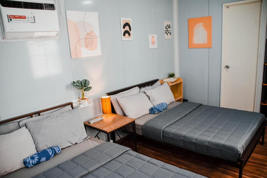 Postel nebo postele na pokoji v ubytování Olive Hostel Roxas City