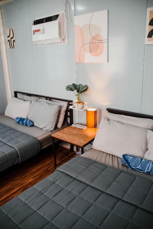 Postel nebo postele na pokoji v ubytování Olive Hostel Roxas City