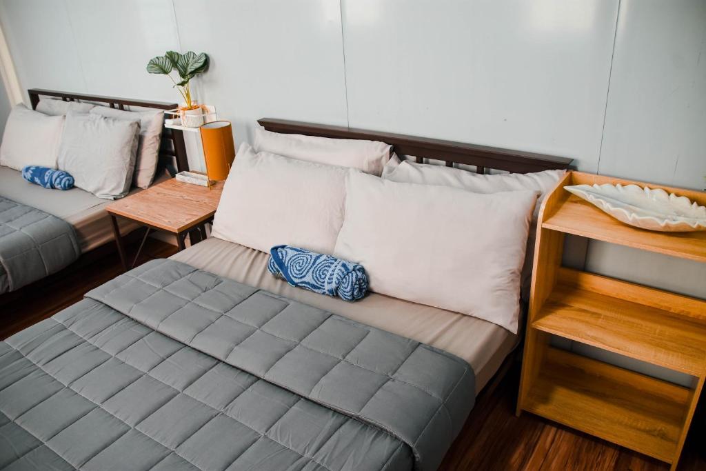 Postel nebo postele na pokoji v ubytování Olive Hostel Roxas City