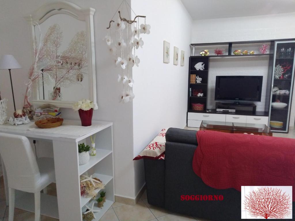 A seating area at Rami di Corallo Appartamento con Parcheggio Privato ----------