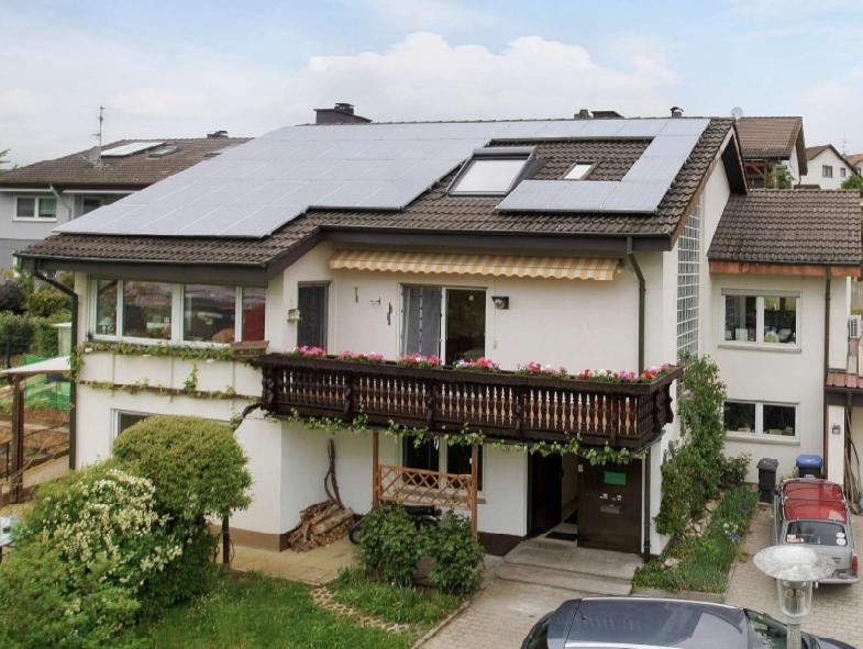 a house with solar panels on top of it at Haus Am Ölberg in Karsau