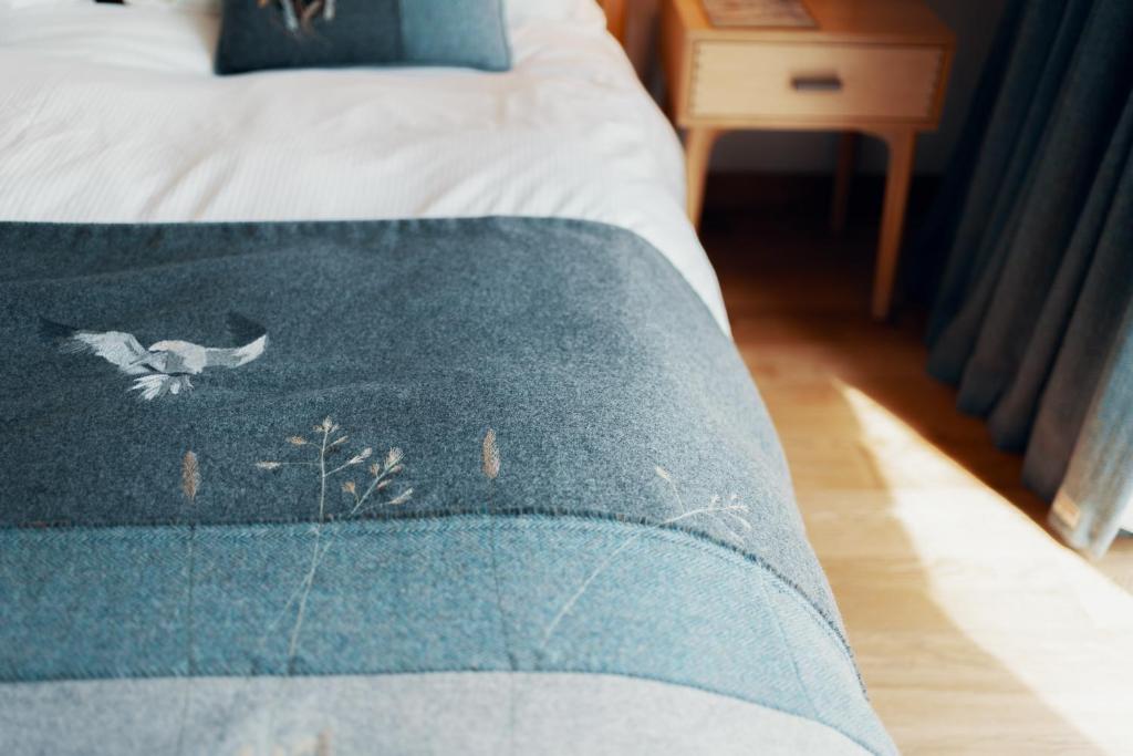 Postel nebo postele na pokoji v ubytování Air an Oir - Skye Self Catering