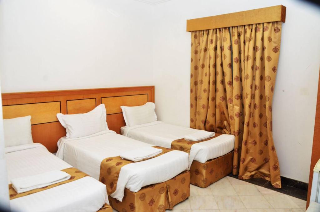 Postel nebo postele na pokoji v ubytování Hamad Saif Batal Hotel