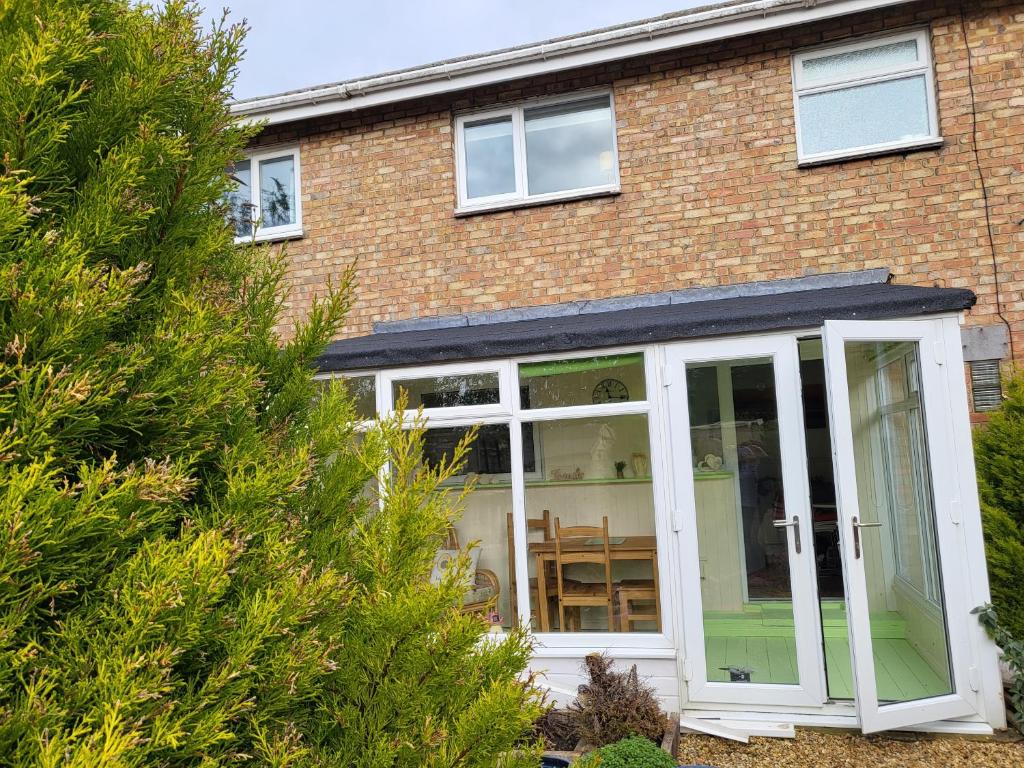 an extension to a house with a conservatory at Alis haven in Pegswood