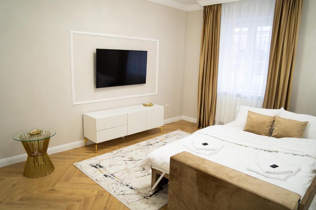 Katil atau katil-katil dalam bilik di Central Parc Golden Apartament 1