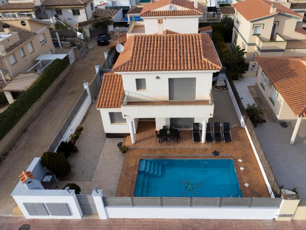 an aerial view of a house with a swimming pool at Villa Victor in Riumar