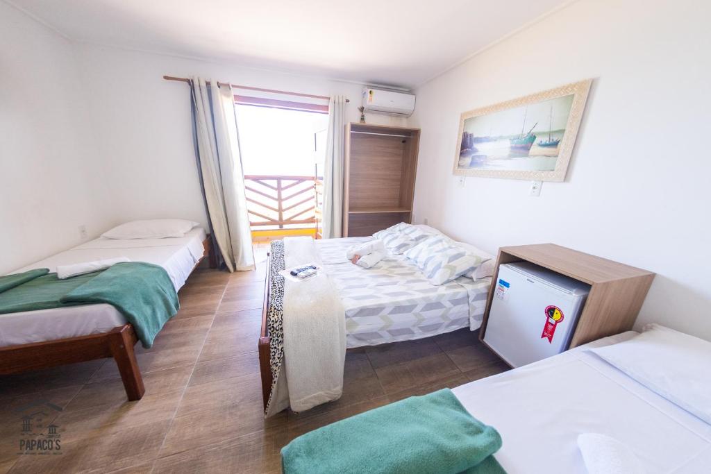 Ein Bett oder Betten in einem Zimmer der Unterkunft Complexo Papaco's