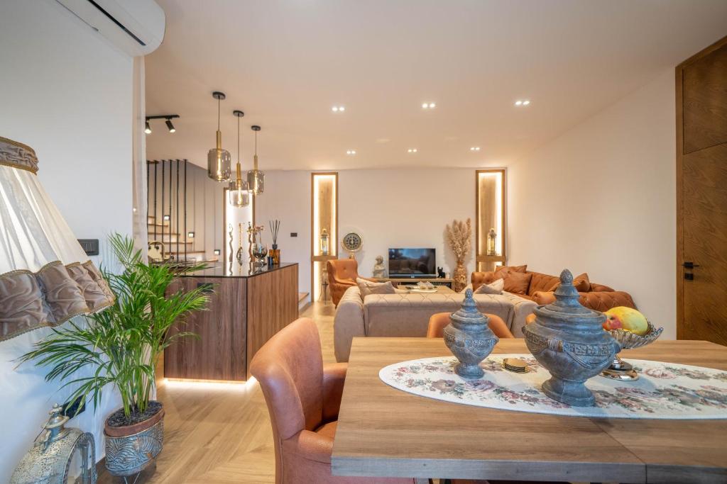 a living room with a table and a couch at Apartments Nikčević in Kotor