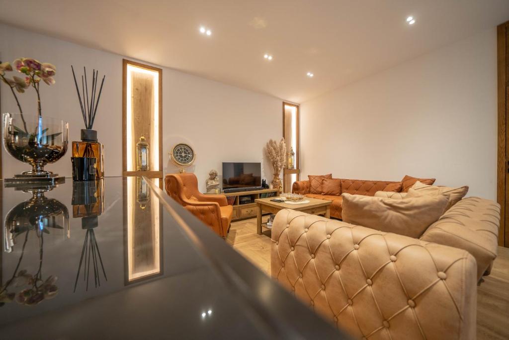 a living room with a couch and a table at Apartments Nikčević in Kotor