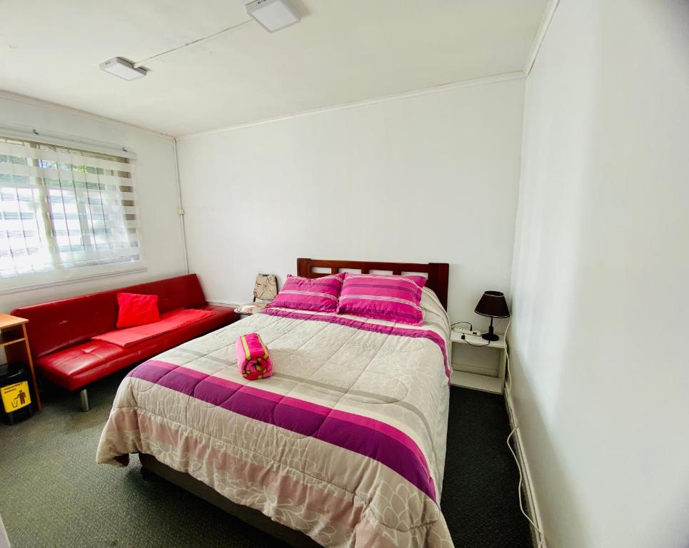 Un ou plusieurs lits dans un hébergement de l'établissement Habitación Doble dentro de una casa
