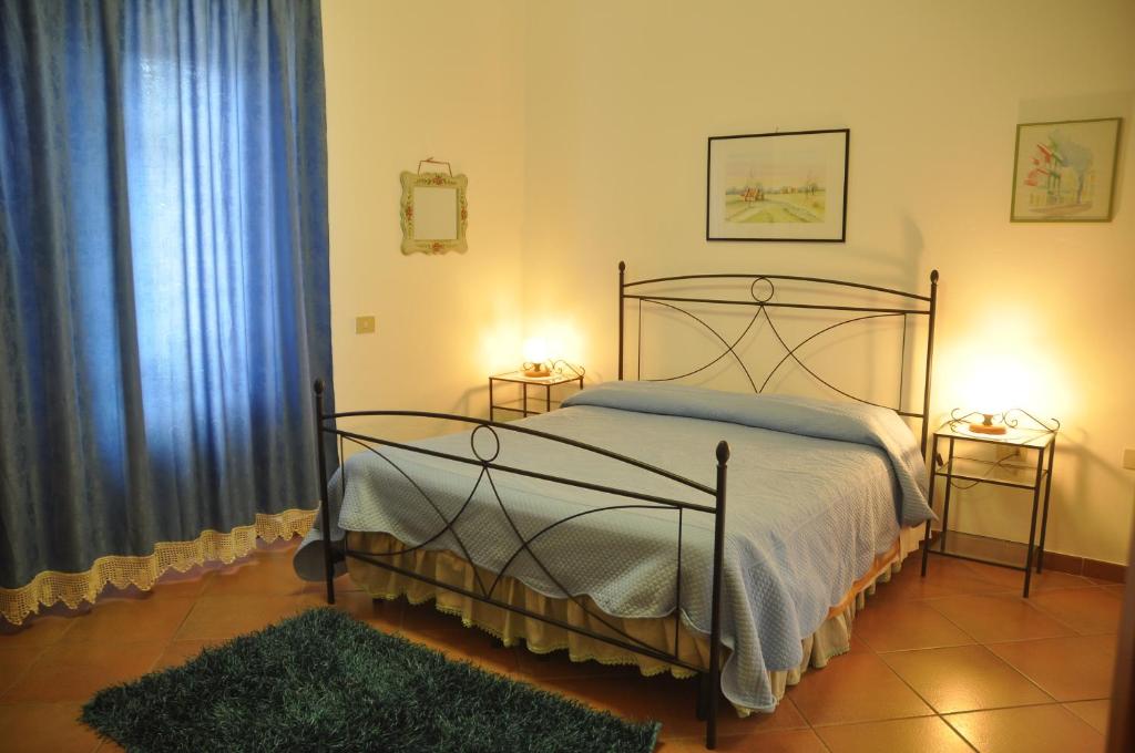 Postel nebo postele na pokoji v ubytování Hotel California