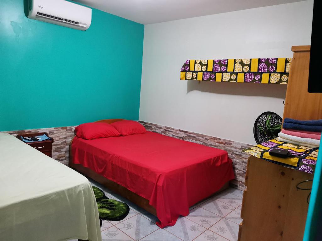 Кровать или кровати в номере Cabinas Mitchaelle's