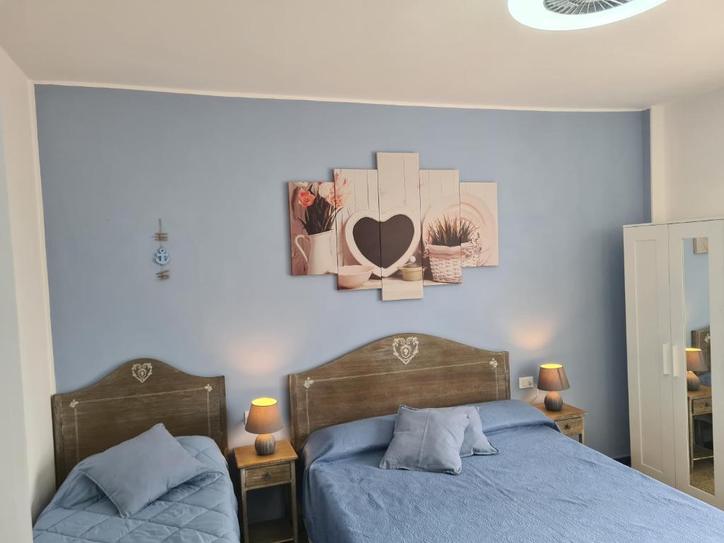 Postel nebo postele na pokoji v ubytování Pippo a Vernazza Rooms