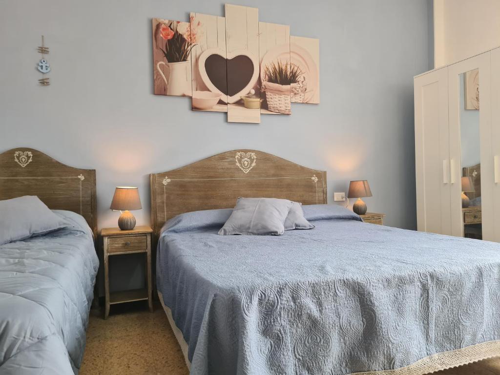 Postel nebo postele na pokoji v ubytování Pippo a Vernazza Rooms