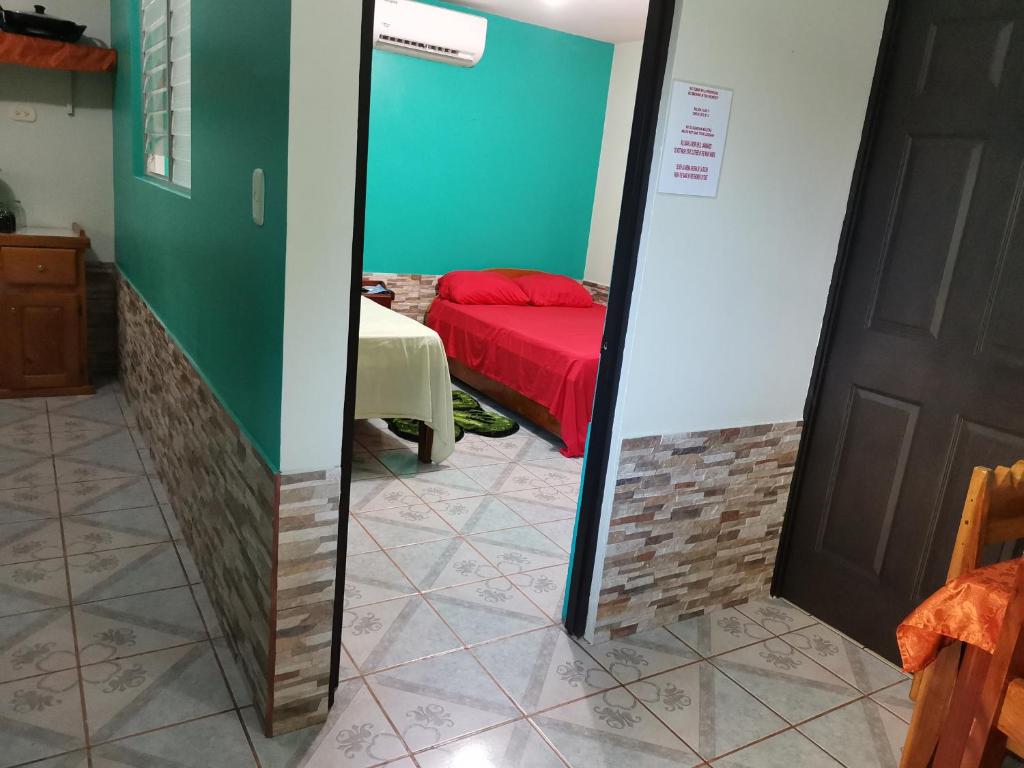 Кровать или кровати в номере Cabinas Mitchaelle's