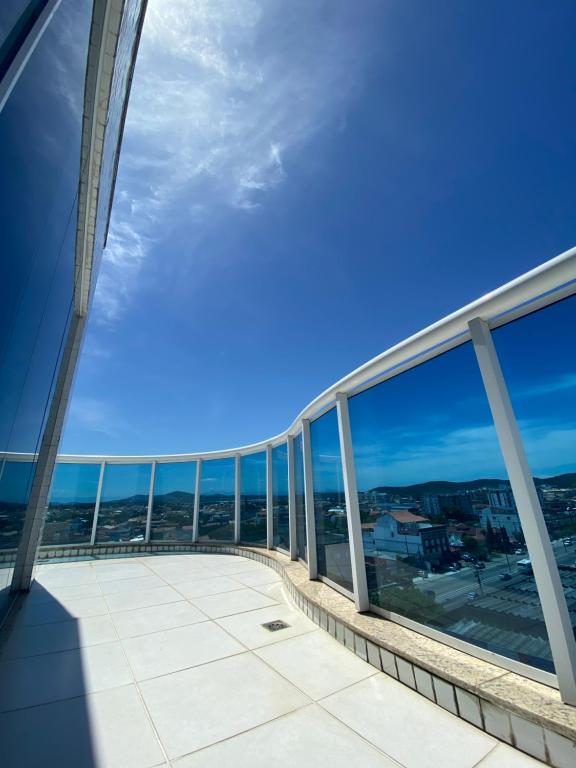 a view of the ocean from the balcony of a building at Hotel Real in Cabo Frio