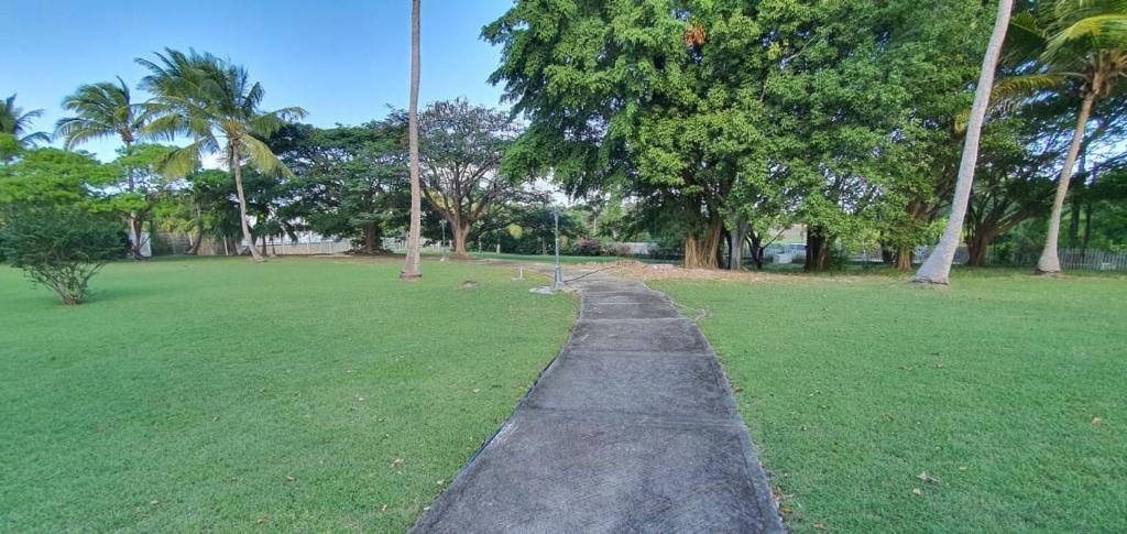 Zahrada ubytování Grand studio Tropical idéalement situé, jardin et piscine