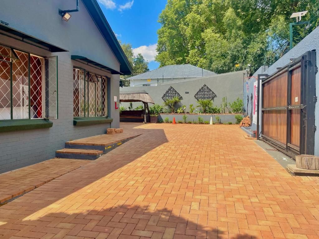 a brick driveway in front of a building at Timebridge Mansions in Johannesburg