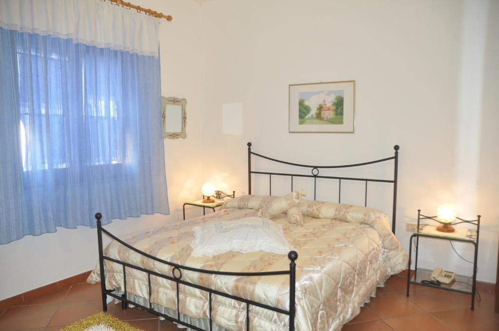 Postel nebo postele na pokoji v ubytování Hotel California