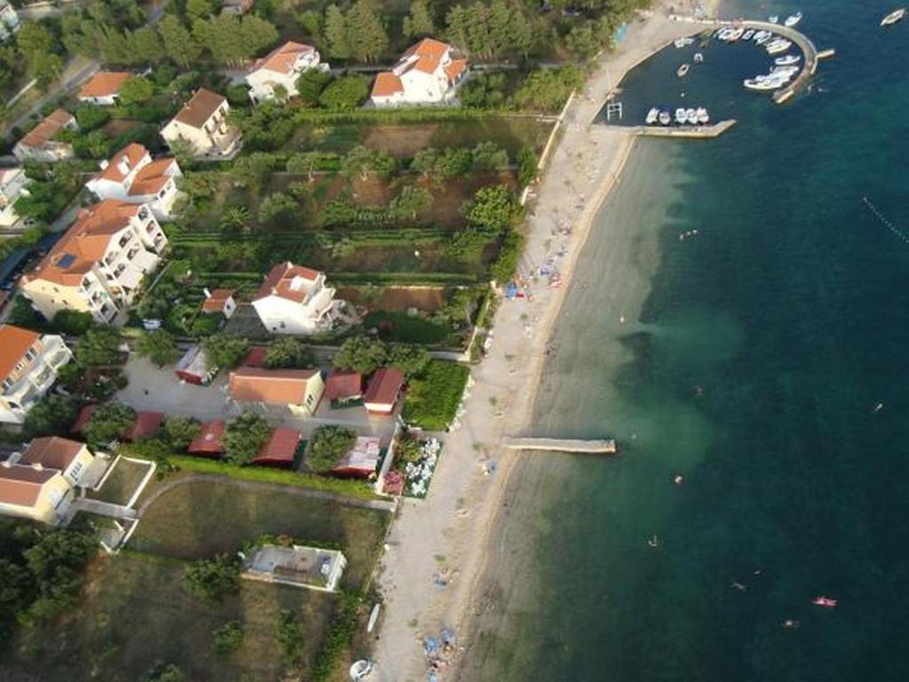 an aerial view of a beach with houses and the water at Apartments Adria in Biograd na Moru