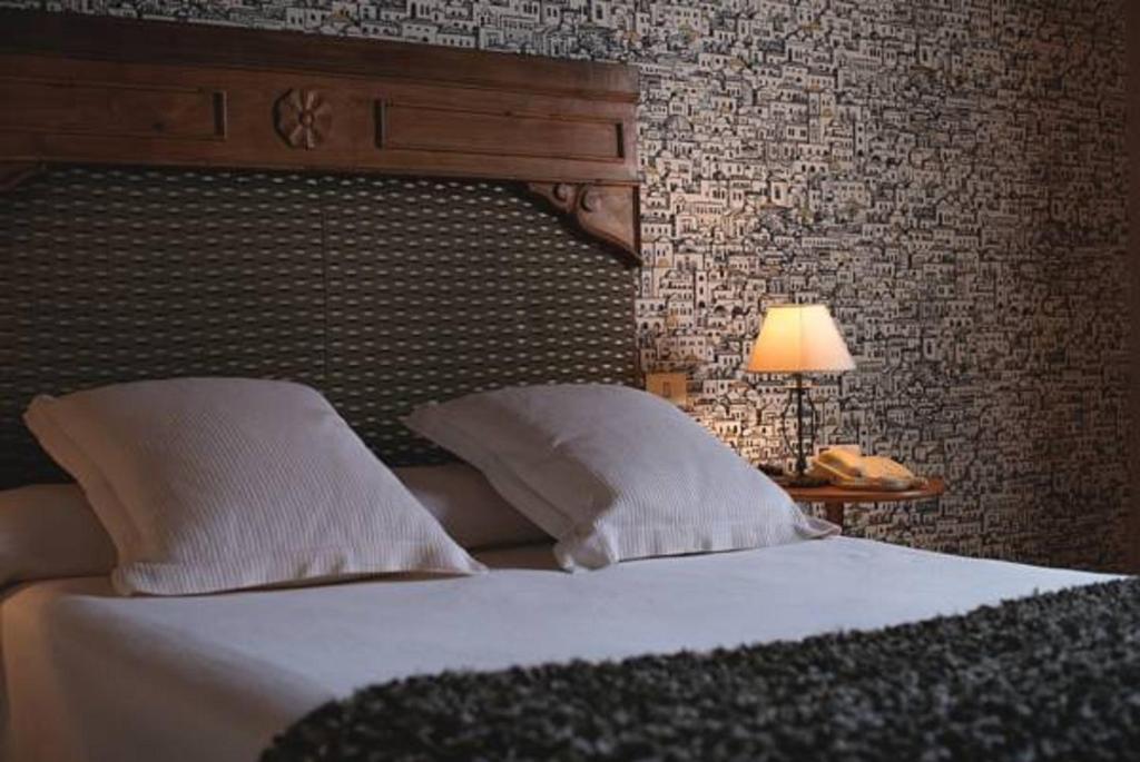 Postel nebo postele na pokoji v ubytování Hotel Konbenio