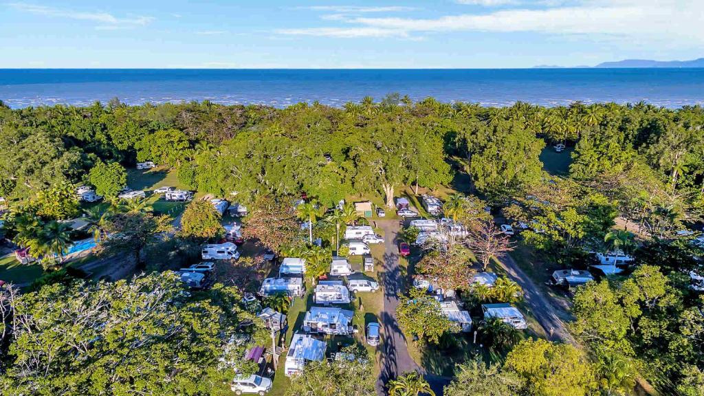 an aerial view of a campground with trees and the ocean at Daintree Beach Resort in Wonga