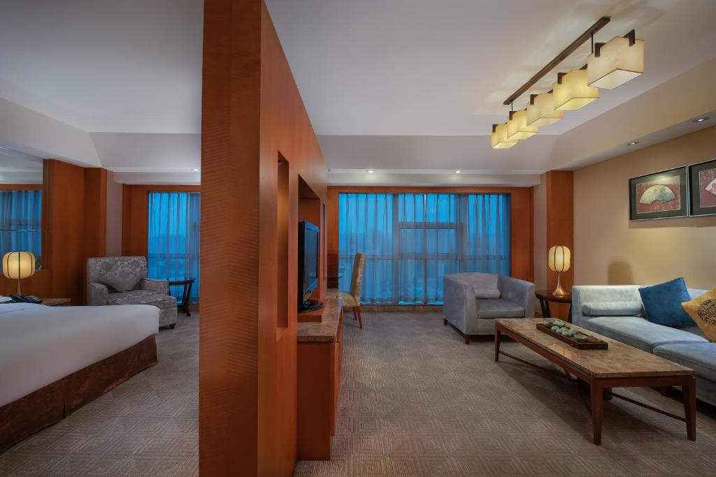Postel nebo postele na pokoji v ubytování Empark Grand Hotel Xi'an