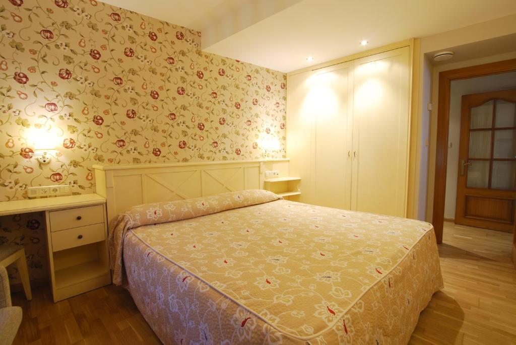 Postel nebo postele na pokoji v ubytování Hotel Bujaruelo