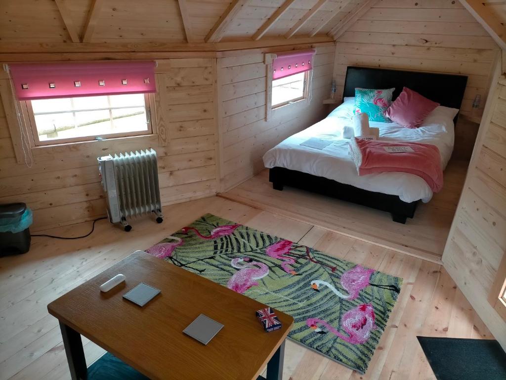 an overhead view of a bedroom with a bed and a table at Oak Tree Escape in Brome
