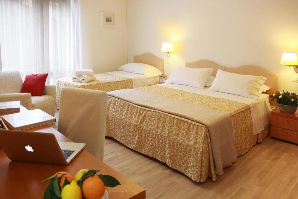 Postel nebo postele na pokoji v ubytování Residenza Giacomuzzi