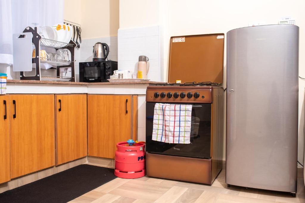 Kuchyň nebo kuchyňský kout v ubytování Luxury 1Br Apartment with Secure Parking & Lift Nakuru