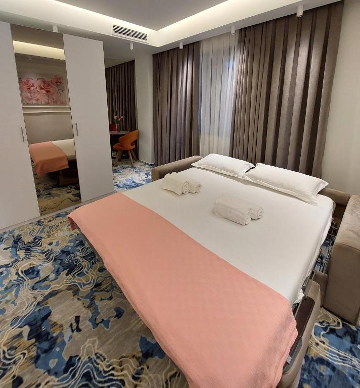 Postel nebo postele na pokoji v ubytování Apartments Jordan Luxury - Gevgelija