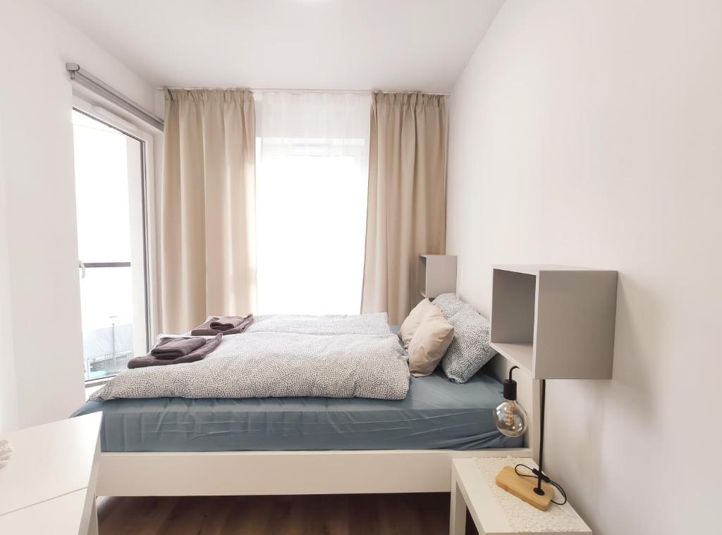 Posteľ alebo postele v izbe v ubytovaní Mogilska 120D by Homeprime